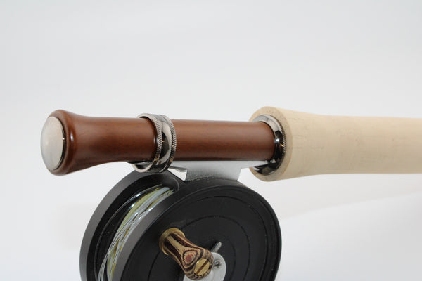 Up-locking mortised slide band reel seat in cocobolo with plated hardware